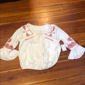 Free people white embroidered shirt.